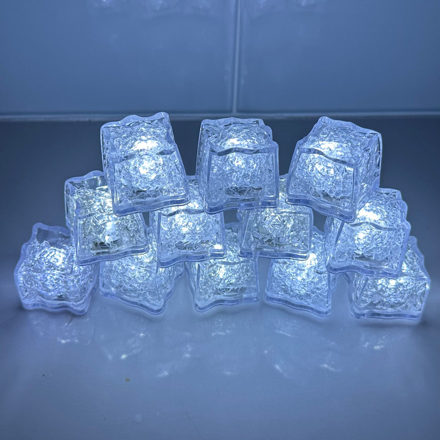 White LED Light up ice cubes with Push Button on/off.   Push Button cubes last longer and work in ice, unlike cubes with moisture sensors (which only work when submerged in liquid).  When on, the bright color operates in 3 modes: slow flash, fast flash, and steady on.  When off, cubes are clear.  FDA approved clear acrylic shell is sealed with freezable gel inside and is submersible safe in beverages.  They are fun LED party lights 